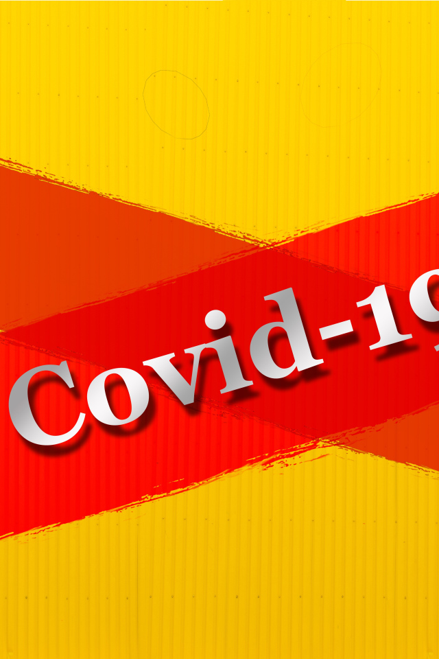 Красная надпись Ковид - 19 на желтом фоне 