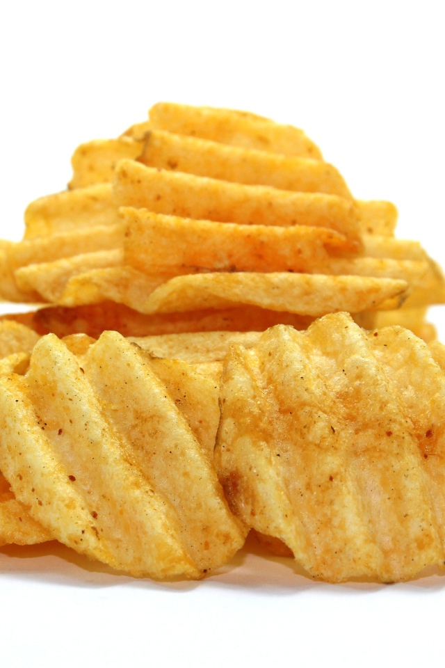 Appetizing potato chips on gray background