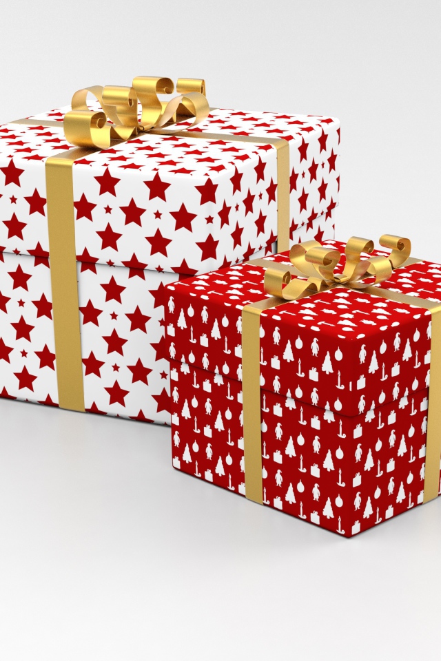 Две яркие коробки с подарками на сером фоне