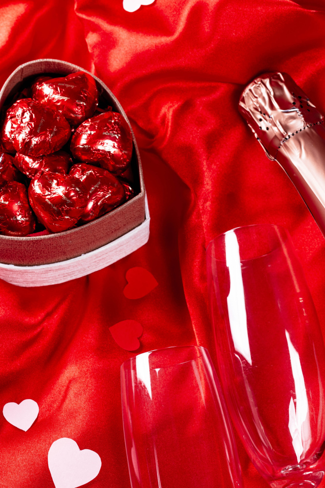 A bottle of champagne and a gift for your beloved on Valentine's Day