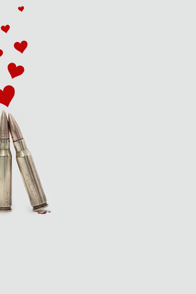 Два патрона с сердечками на сером фоне