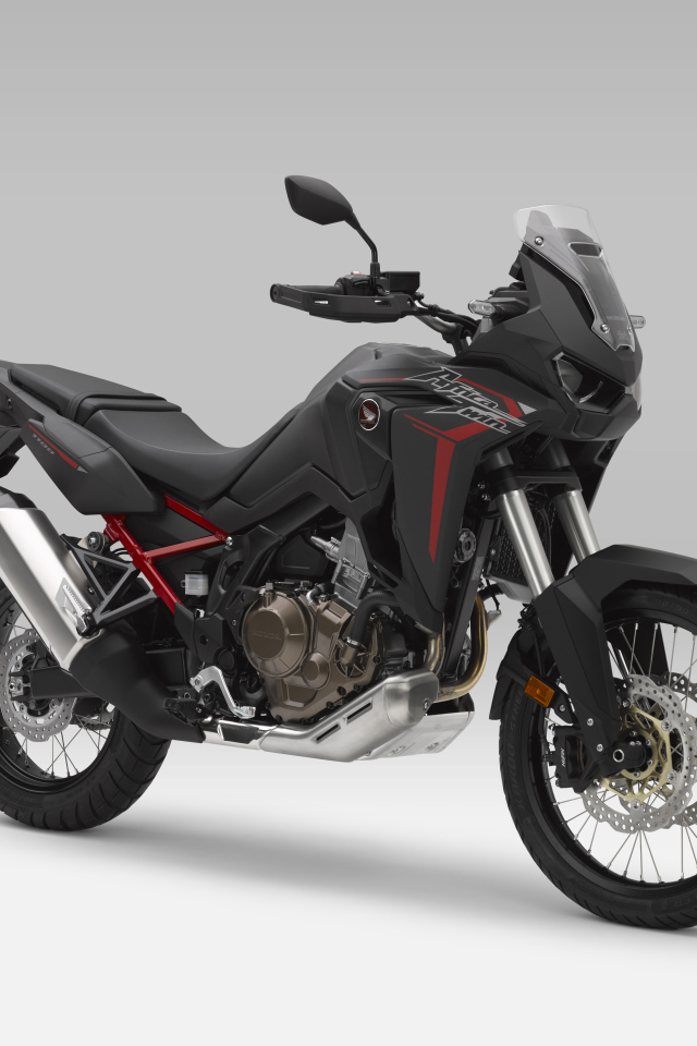 Черный мотоцикл Honda CRF1100L Africa Twin, 2021 года на сером фоне