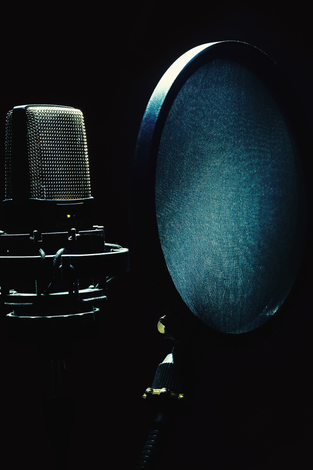 Studio microphone with filter in the dark