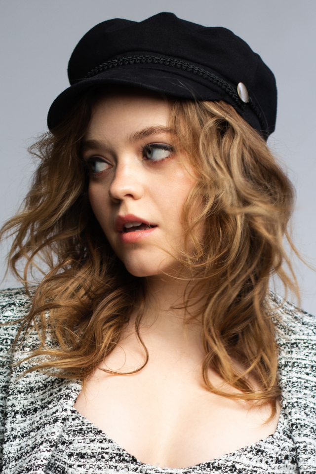 Actress Jade Pettyjohn looking away against a gray background