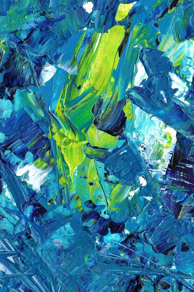 Синие и желтые краски смешанные на палитре