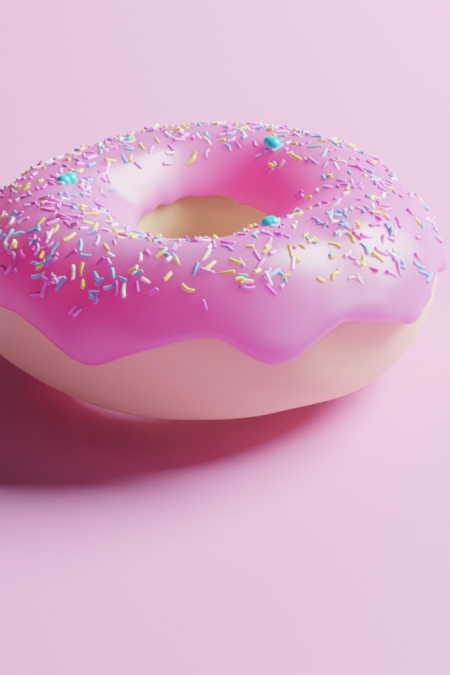 Пончик с глазурью на розовом фоне