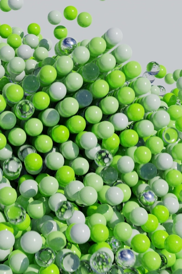 Много пластиковых и стеклянных зеленых шариков