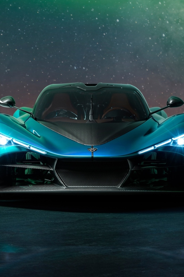 Вид спереди на дорогой автомобиль Zenvo Aurora Agil  ночью