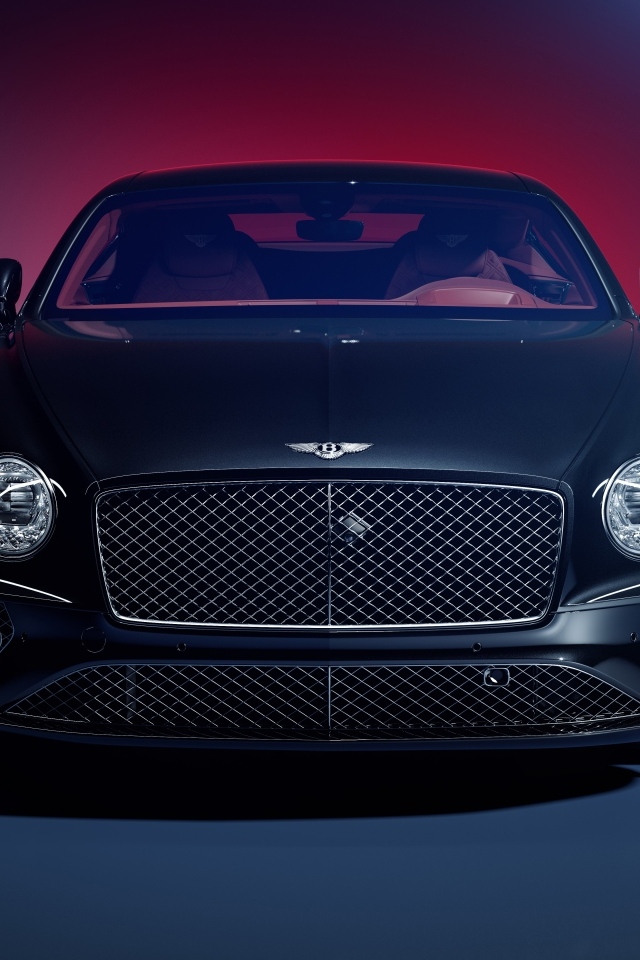 Вид спереди на автомобиль Bentley Continental GT на синем фоне