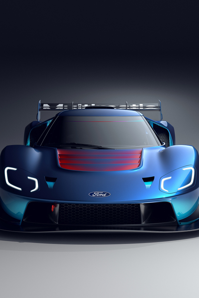 Синий автомобиль Ford GT MkIV 2023 на сером фоне