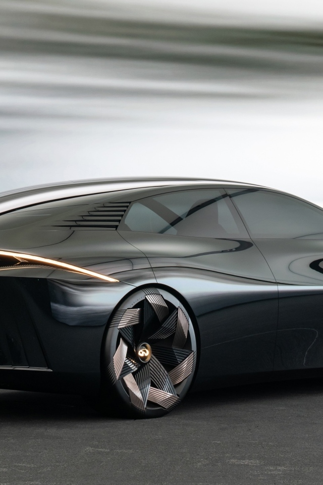 Вид сзади на черный автомобиль концепт Infiniti Vision Qe 2023 года