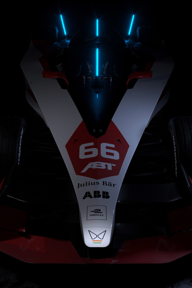 Гоночный автомобиль ABT Sportsline Mahindra M9Electro 2022 на черном фоне