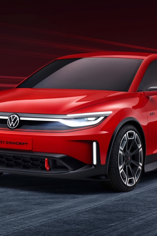 Красный Volkswagen ID. GTI Concept 2023 года с включенными фарами