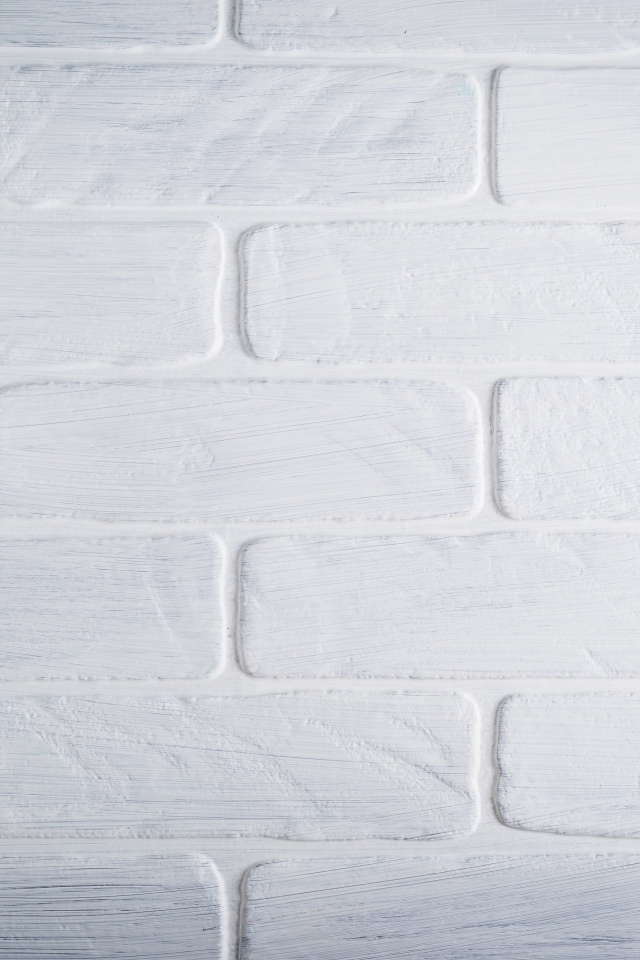 Белая кирпичная стена крупным планом