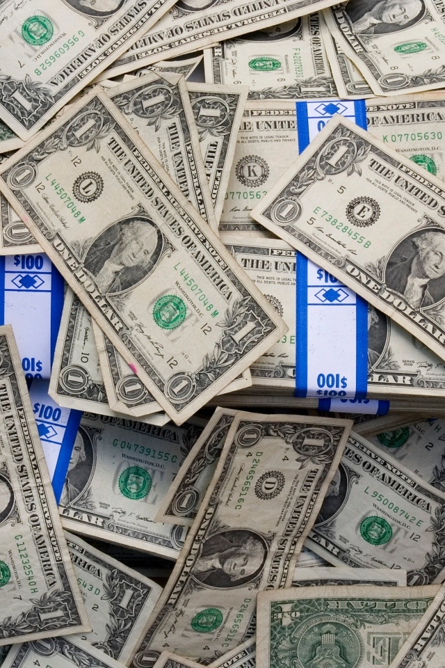 Много купюр в один доллар крупным планом