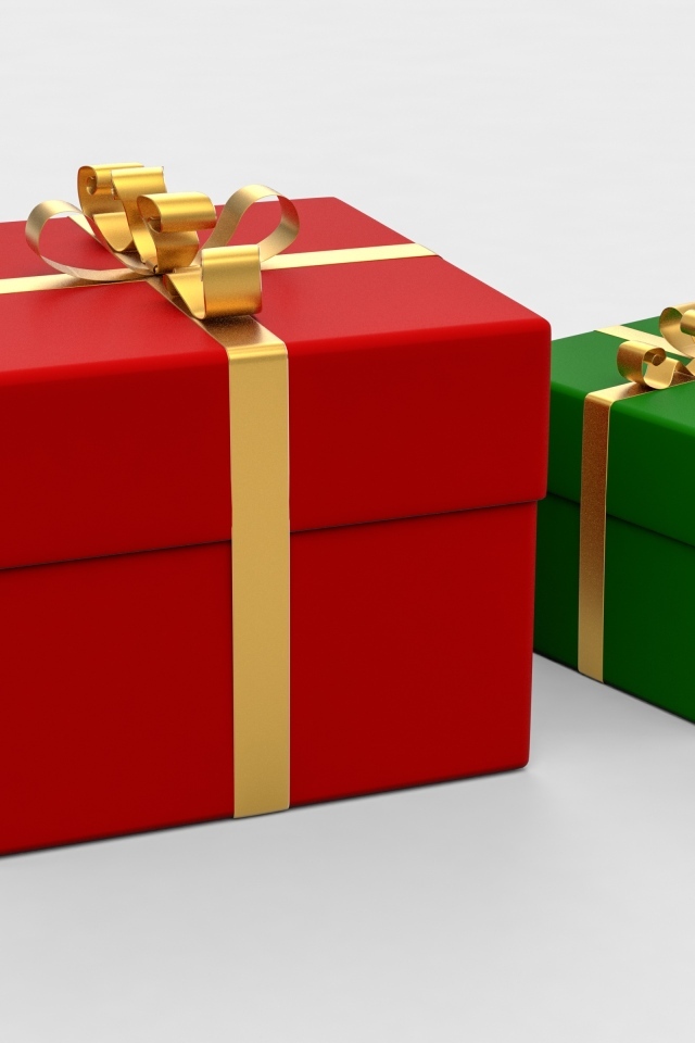 Красная и зеленая подарочная коробка на белом фоне