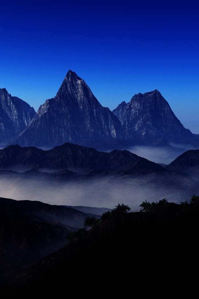 Три горные вершине в тумане