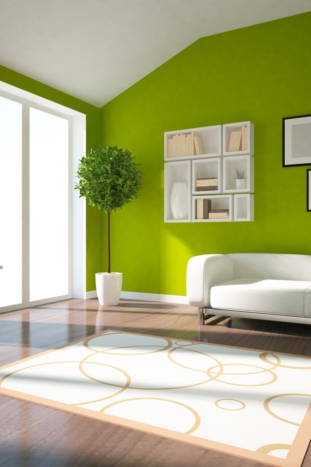 Зеленые стены в гостиной комнате с белым диваном