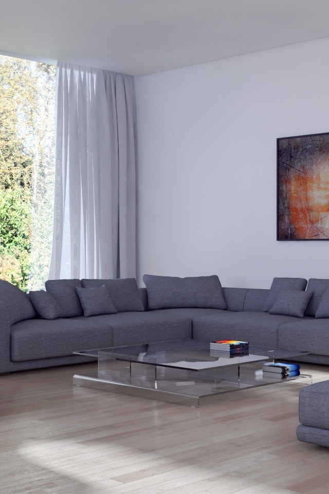 Большой серый диван в гостиной комнате