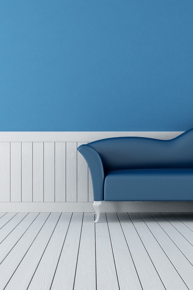 Диван в комнате с голубыми стенами и белым полом