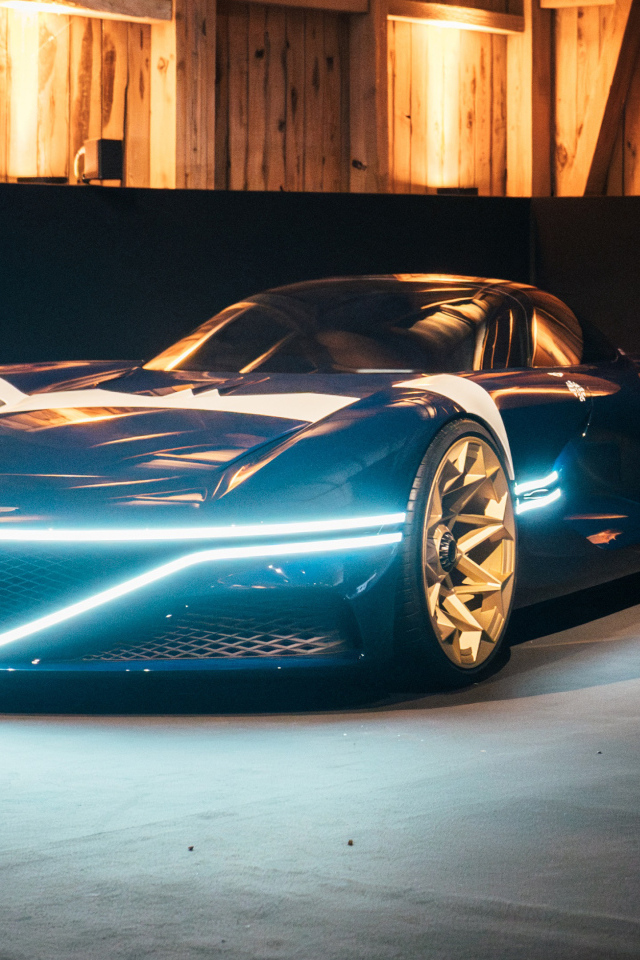 Автомобиль Genesis X Gran Berlinetta Tribute 2024 года с включенными фарами