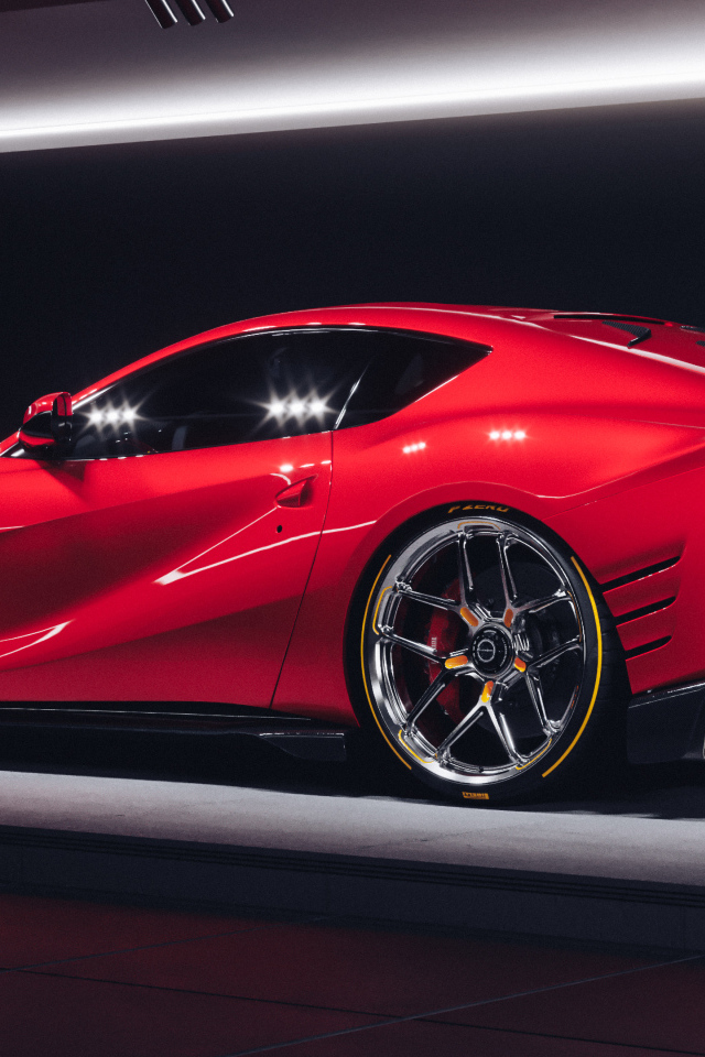 Красный быстрый автомобиль Ferrari 812 Competizione вид сзади