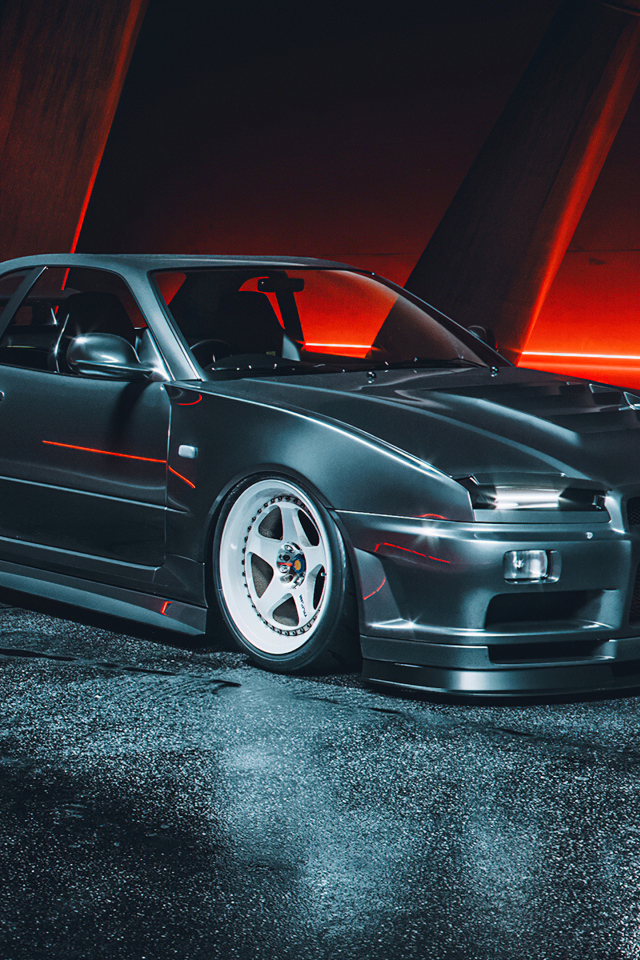 Черный автомобиль Nissan Skyline GTR R34