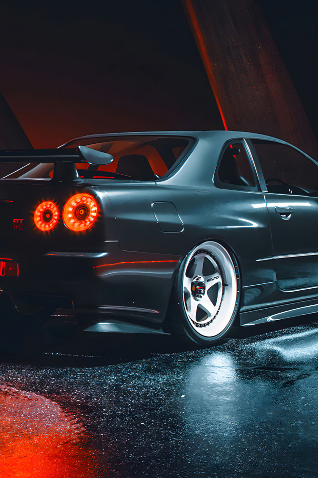 Черный автомобиль Nissan Skyline GTR R35 вид сзади