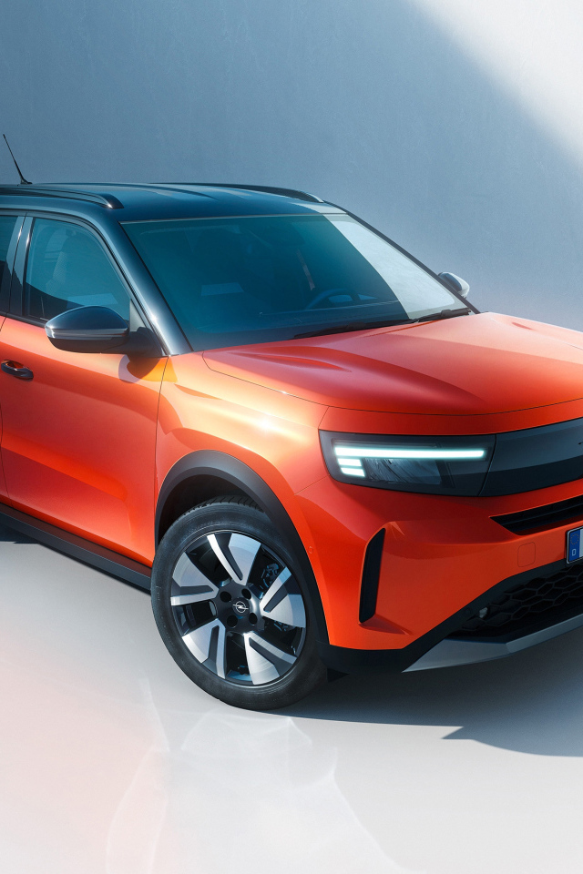 Красный автомобиль Opel Frontera Electric 2024 года