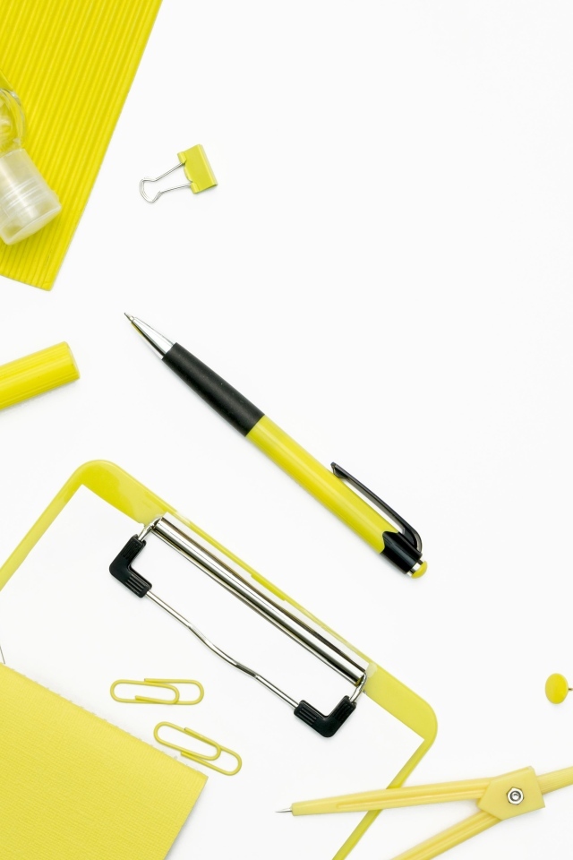 Yellow stationery items on a white background