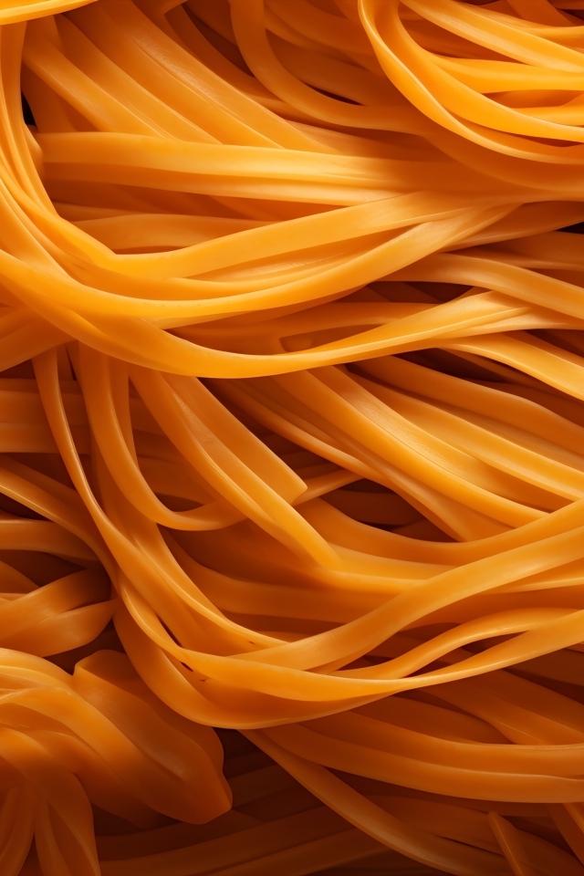 Оранжевые спагетти крупным планом
