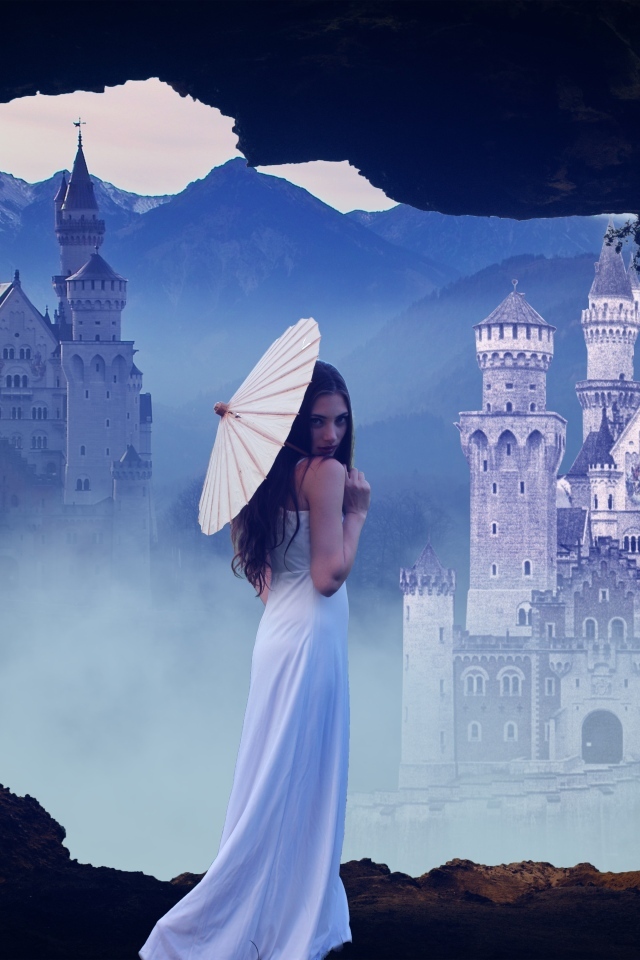 Девушка в белом платье с зонтом на фоне замка