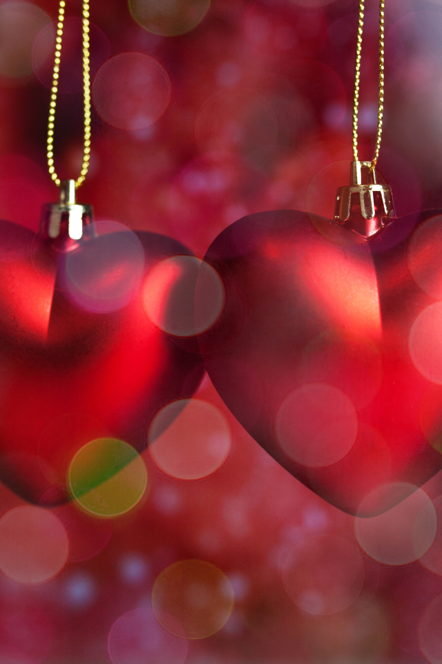 Two red hearts on a chain