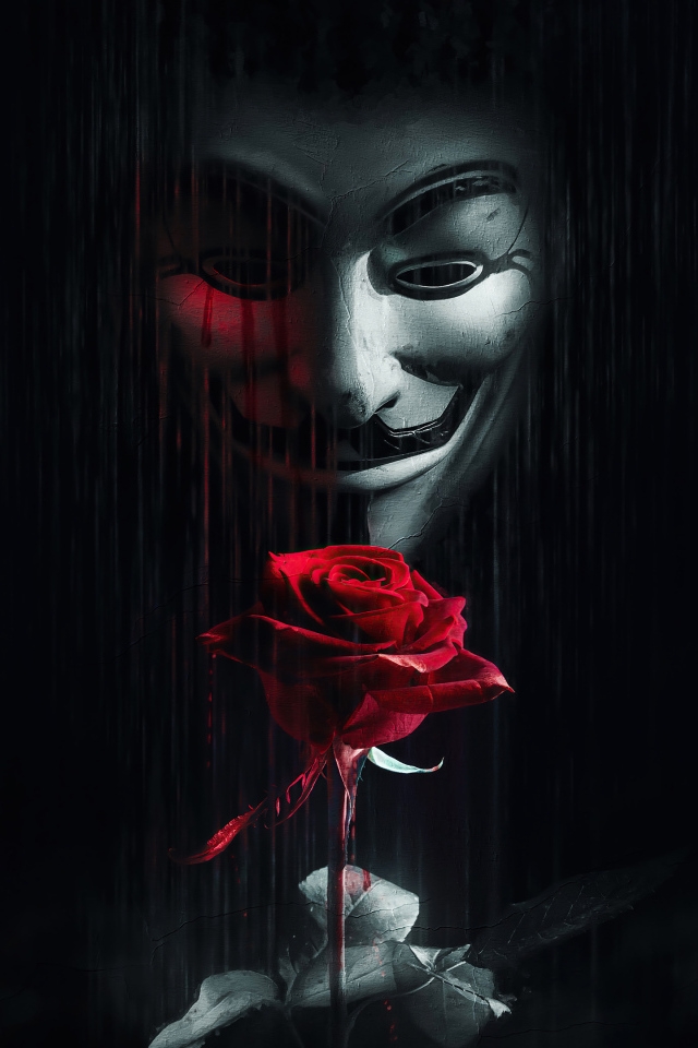 Человек в маске анонимуса с красной розой