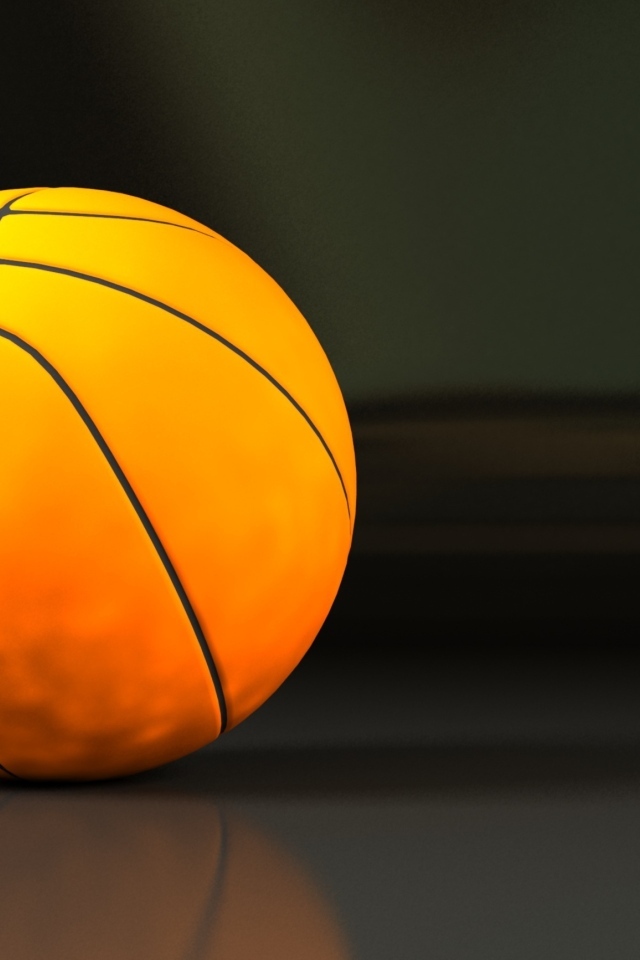 Большой оранжевый мяч на сером фоне