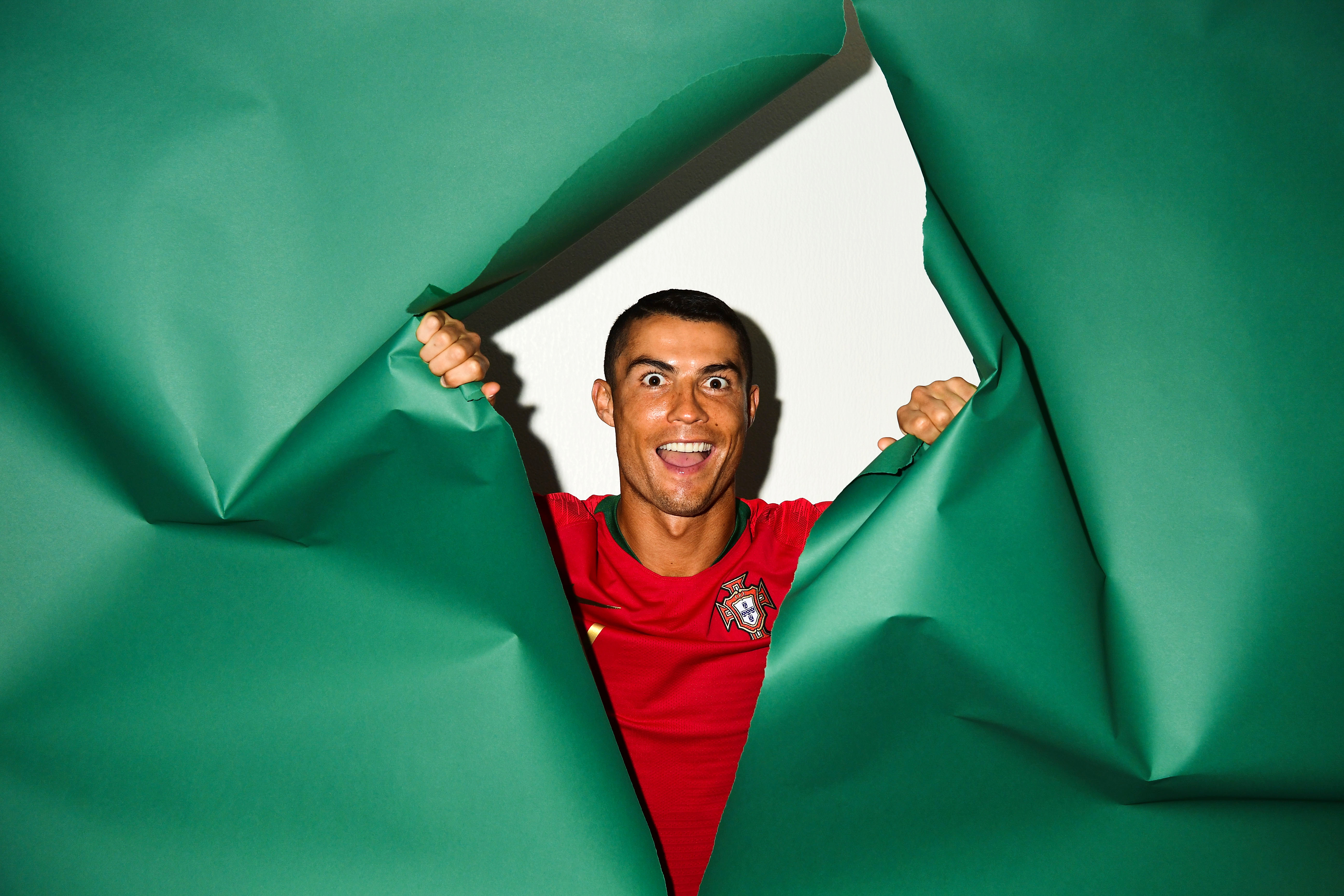 Funny face of football player Cristiano Ronaldo on a green background  Desktop wallpapers 1920x1080